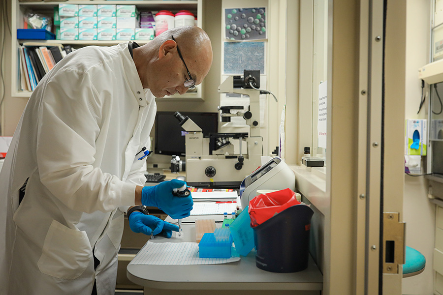 Faculty member conducts research in the Protein Expression Facility.